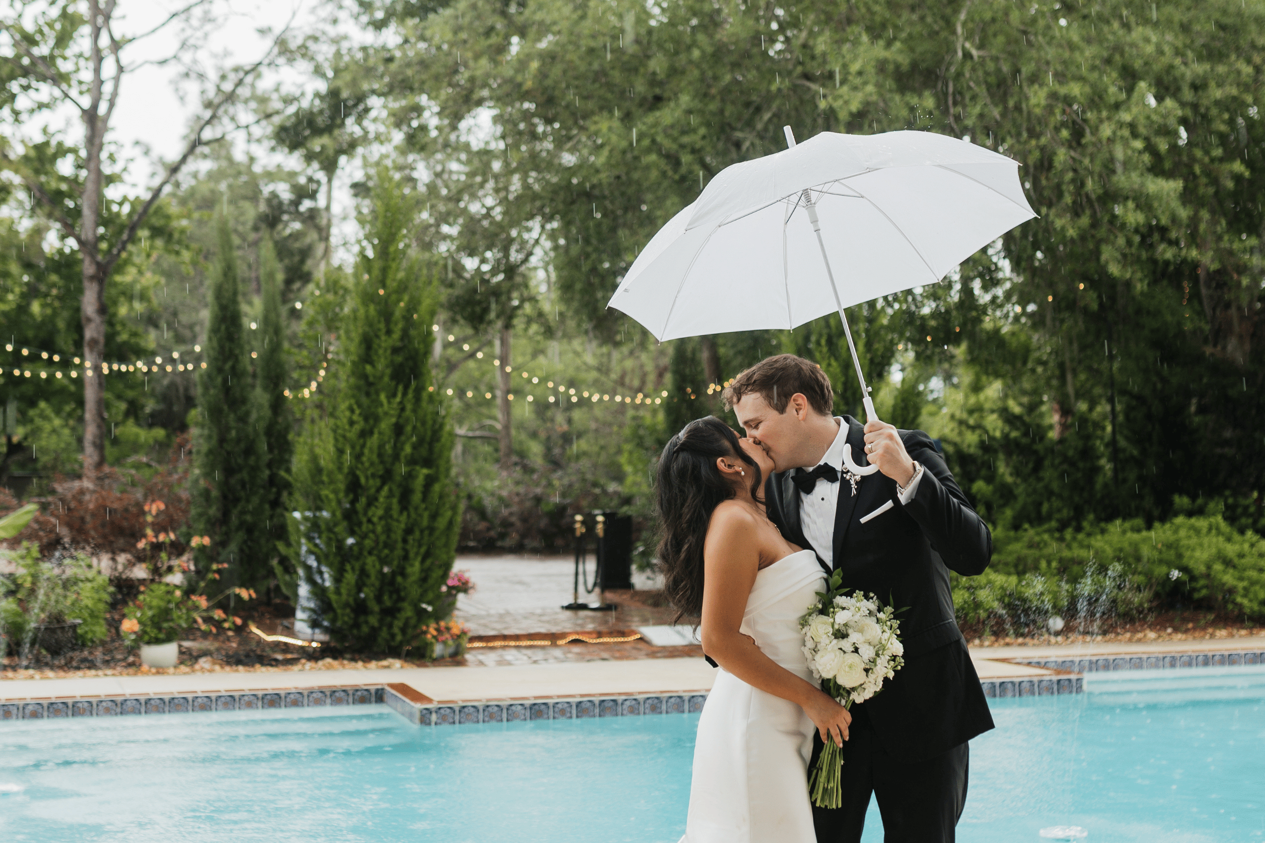 Couple celebrating rain during their wedding