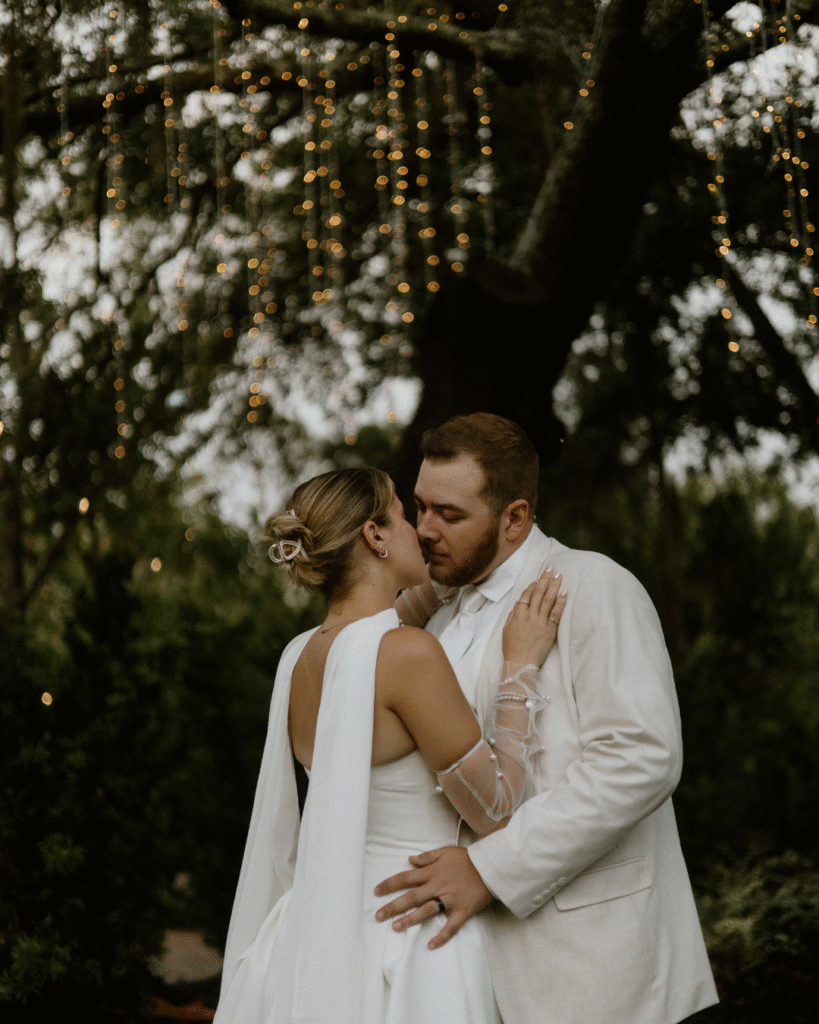 bride and groom under the lights