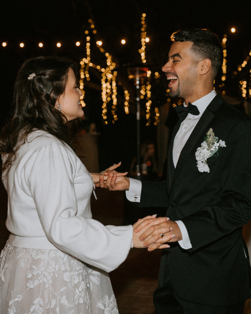 bride and groom under the lights